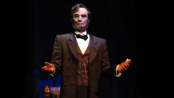The Abraham Lincoln animatronic partially collapsed and folded forward at Walt Disney World Resort at the Magic Kingdom at the Hall of Presidents attraction.