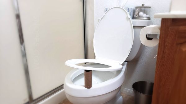 An ad said to always place a toilet paper roll under the toilet seat at night and promised to say why but did not.